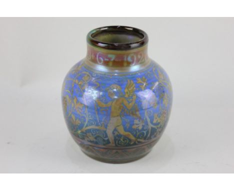 A Richard Joyce for Pilkington Royal Lancastrian lustre vase, of baluster form, decorated with winged figures amongst fruitin