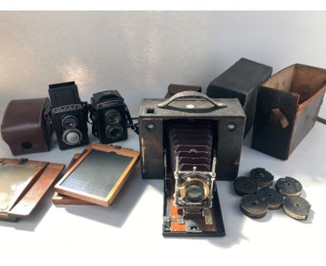 An Eastman Kodak Co, Rochester, New York, folding box camera, the lens stamped JANY.5.1897, in partial leather case, with No.