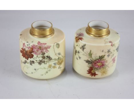 A pair of Royal Worcester porcelain blush ivory vases, of oval form, each decorated with flowers and gilt band to neck, 10.5c