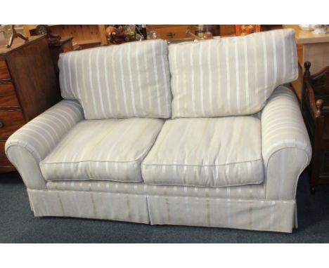 A Laura Ashley two seater sofa, with striped oatmeal coloured upholstery, 178cm