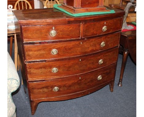 A George III mahogany bowfront chest of two short over three long drawers with circular brass drop handles and Prince of Wale