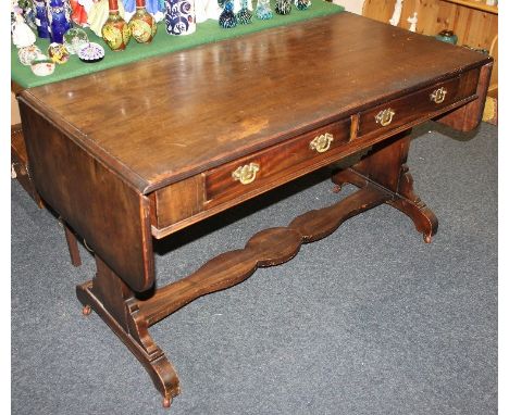 A mahogany sofa table with frieze drawers on shaped end supports with stretcher 126cm