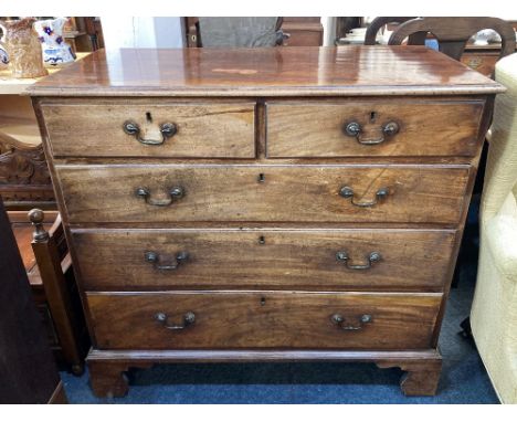 A George III mahogany chest of two short over three long drawers with brass swing handles, on bracket feet, 109.5cm