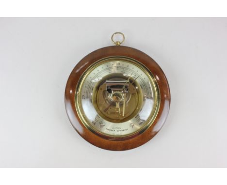 A modern Huger circular wall barometer, in wooden frame, 19cm
