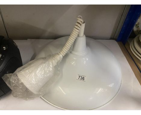 A large metal rise and fall ceiling light 