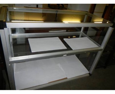 A double shelf glass counter, COLLECT ONLY.