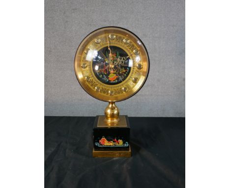 A mid 20th century Russian mantle clock, with hand painted spherical dial and base, decorated with figures in a sleigh, raise