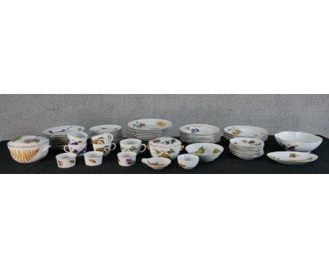 Sixty pieces of Royal Worcester 'Evesham' pattern part dinner service, to include bowls, plates and lidded tureens. 