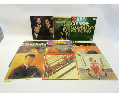 A collection of assorted Jazz and Pop LP's including The Beatles, Buddy Holly, Bob Marley, Dizzy Gillespie, Joe Bushkin, The 