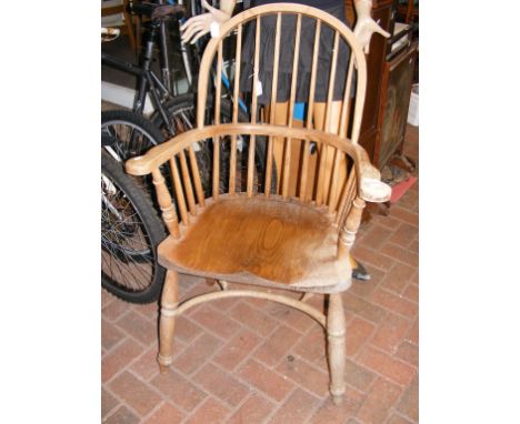 A stick back country armchair