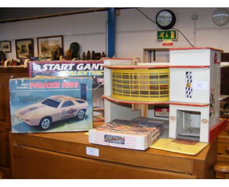 A vintage Start Gantry Scalextric Set, together with radio controlled Porsche 928S, Team Suzuki computer game and a model gar