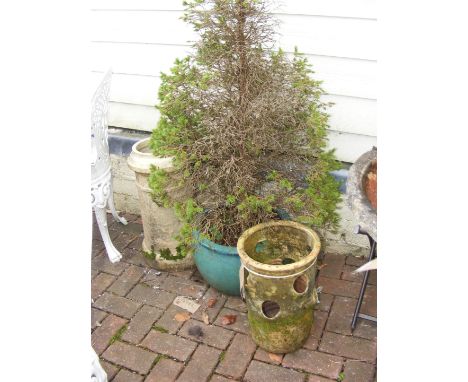 A terracotta strawberry planter, chimney pot, green glazed pot with plant 