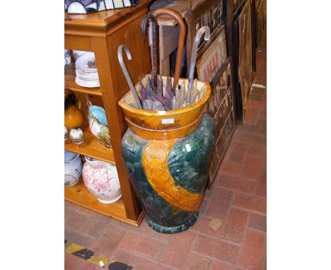 A majolica glazed corner umbrella and stick stand, together with four vintage umbrellas  CONDITION REPORT Height, 66cmWe have