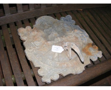 An old decorative lead wall sundial