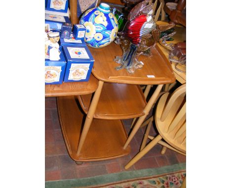 A vintage mid century Ercol 'Golden Dawn' three tier drinks trolley on castors 