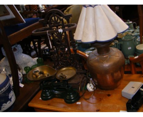 An Arts & Crafts style copper table lamp, vintage scales, cast metal umbrella and stick stand 