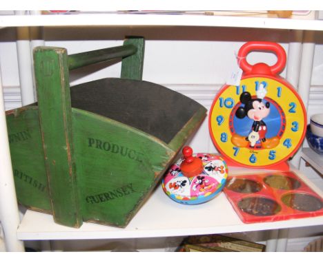 A vintage 1981 Walt Disney Mickey Mouse clock, together with other Disney items and a wooden garden tools basket