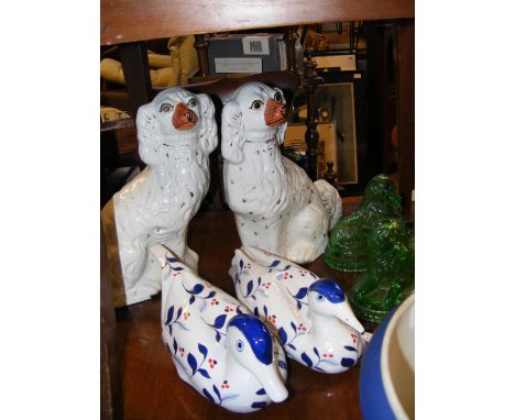 A pair of Staffordshire mantel dogs, a pair of Chinese ornamental ducks and a pair of green glass dog jelly moulds 