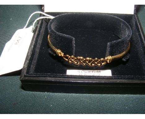 A 9ct gold bangle