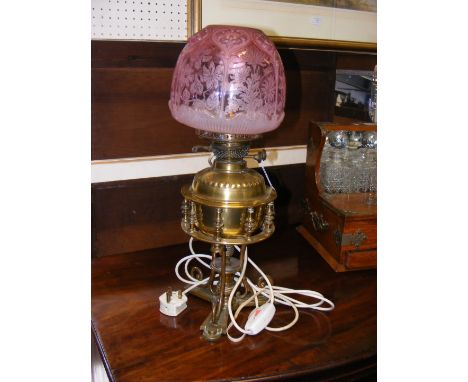 A Victorian brass oil lamp with duplex burners and pink glass shade CONDITION REPORT We have attached a number of additional 