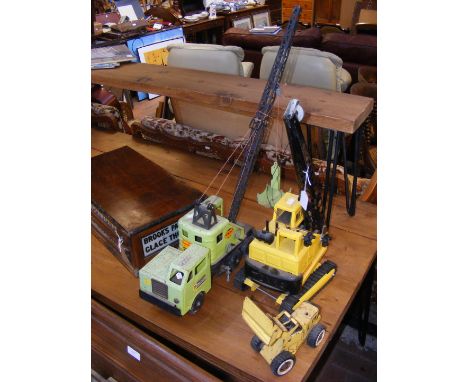 Three vintage model tinplate construction vehicles, including a Tonka crane 