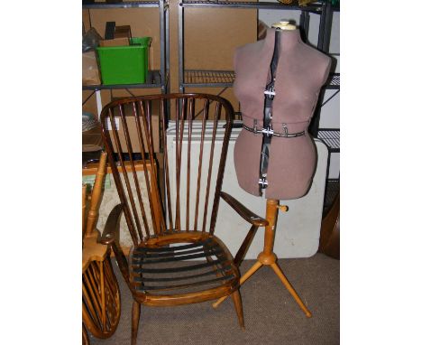 An Ercol dark wood spindle back armchair, together with a vintage tailor's dummy 