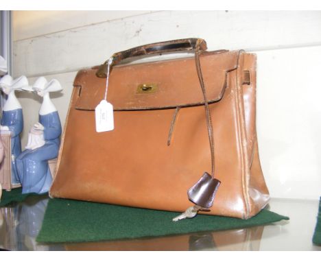 A 1950's Hermes 'Kelly' bag CONDITION REPORT 33cm wide21.5cm high (not incl. handle)14cm depthOur team of trusted experts are
