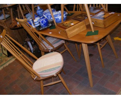 A vintage mid century Ercol 'Golden Dawn' dining table, together with six Ercol Goldsmith dining chairs 