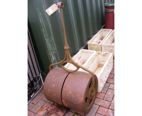 A vintage metal garden roller 