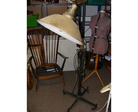 A vintage industrial lamp on castor base 