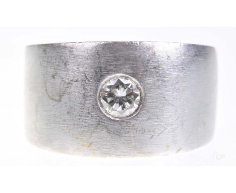 A diamond single stone ringThe round brilliant cut diamond to a chunky white metal mount stamped 9ct, diamond weight approx. 