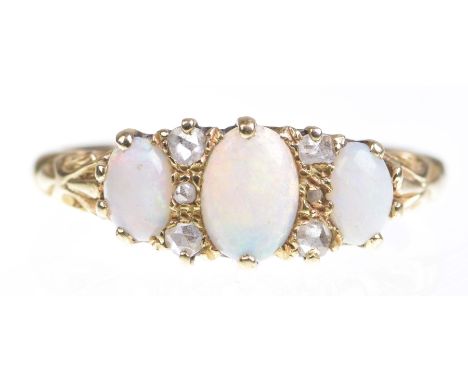 A Victorian opal and diamond ringThe graduated opal cabochons with rose-cut diamond highlight, to a scroll shank stamped 18ct