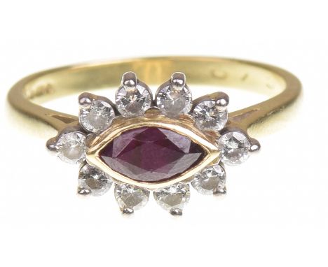 A ruby and diamond cluster ringThe marquise shaped ruby, to a round brilliant cut diamond surround, to an 18k gold shank, tot