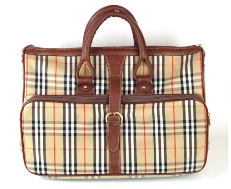 Burberrys': A holdall bagA large Haymarket check canvas holdall with leather trim, rolled leather handles, buckle fastening a