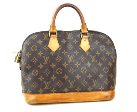 Louis Vuitton: An Alma handbagWith monogram coated canvas print, the flat base tapered to a zip closure with padlock, with ca