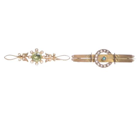 A Victorian peridot and seed pearl bar broochThe circular shaped peridot, to a seed pearl surround, with open work scroll det