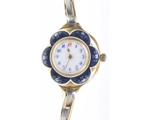An early 20th century ladies manual wind wristwatchThe circular white dial with blue Arabic numerals and gold dot minute mark
