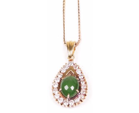 An emerald and diamond pendant In drop form, centring an oval cabochon emerald, to a round brilliant cut diamond surround, in