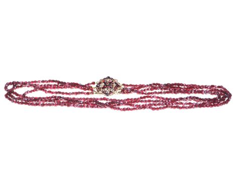 A Victorian Bohemian garnet four strand necklaceThe strands, with irregularly cut garnets, of graduated form, to a delicate u