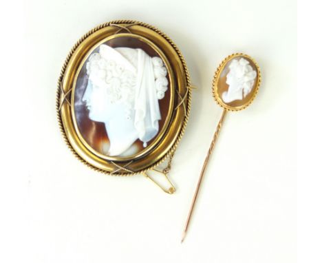 A late 19th Century shell cameo broochThe shell, carved to depict a classical female in profile, to an oval surround with rop