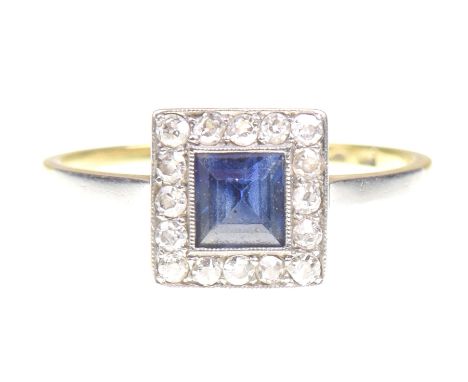 A sapphire and diamond cluster ringThe square shaped sapphire to an single cut diamond surround, ring size P