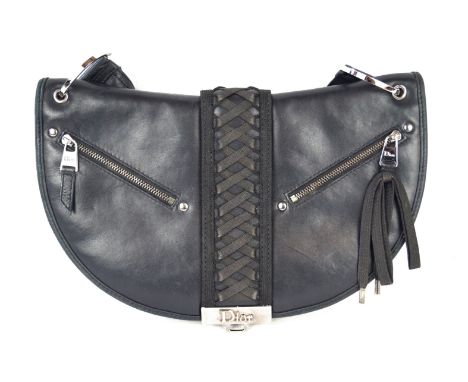 Christian Dior: A black leather braided handbagFeaturing a central braided panel, zip front accents, accordion expandable sid