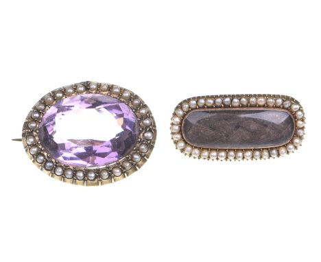 An amethyst and seed pearl broochThe oval shaped amethyst to a seed pearl surround, length 2.4cm, together with, a Victorian 