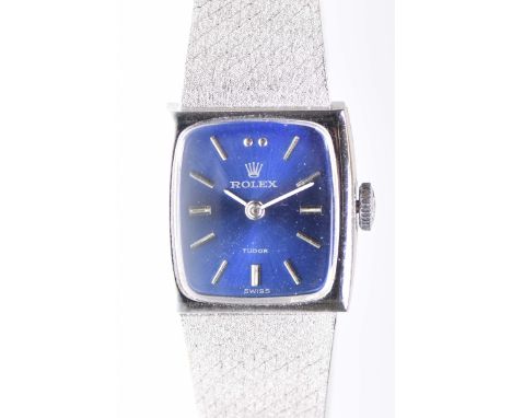 Rolex: A ladies 9k white gold manual wind bracelet watchThe rectangular blue dial, with applied silver tone hour baton marker