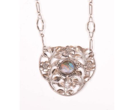 An Arts & Crafts opal and silver necklaceThe circular shaped opal, set to an openwork foliate and leaf surround, to a fancy k