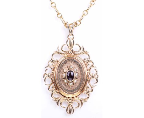A gem set locket and chainVictorian revival style locket, in 9k gold set with a garnet to a seed pearl surround, one pearl de