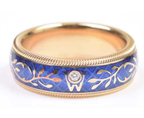 Wellendorff: A ladies enamel and diamond spinning ringThe spinning vivid blue enamel central section to a rope twist border, 