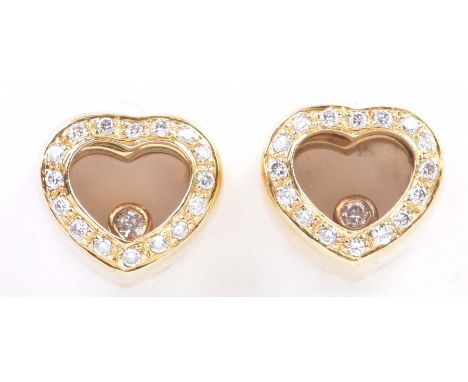 A pair of diamond ear studsIn the style of Chopard, the heart shaped ear studs with round brilliant cut diamond borders, the 