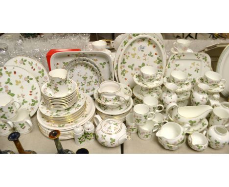 A Wedgwood Wild Strawberry dinner service comprising, meat plate, dinner plates, side plates, cake plate, teapot, cups and sa