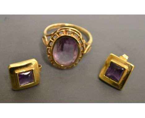 An amethyst dress ring, oval pale purple amethyst, collet set to a pierced open work mount, 9ct gold shank, size K, 3.4g gros